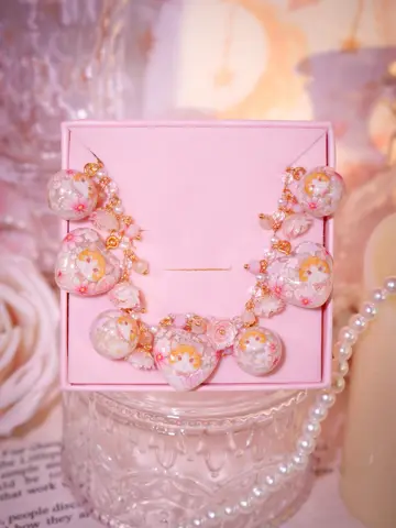 ข้อมือหัวใจกลมครีมแมวส้ม